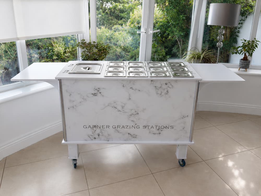 Grazing station styled as a dessert bar with cakes and sweet treats